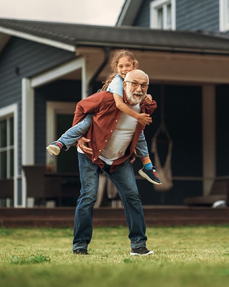 Grandpa holding girl